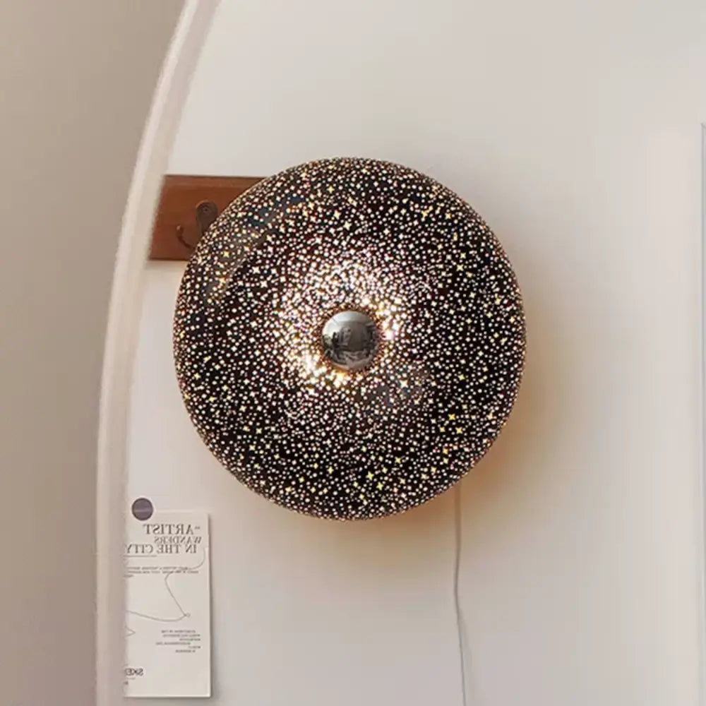 luminária de parede preta, luminária de vidro estrelado, luminária donut, luminária decorativa LED, luminária de parede quarto, luminária com luz tricolor, luminária sofisticada, luminária parede moderna, luminária de parede com toque, luminária criativa LED, luminária radiant parede, iluminação decorativa quarto, luminária donuts, luminária de parede donuts, luminária donuts preta