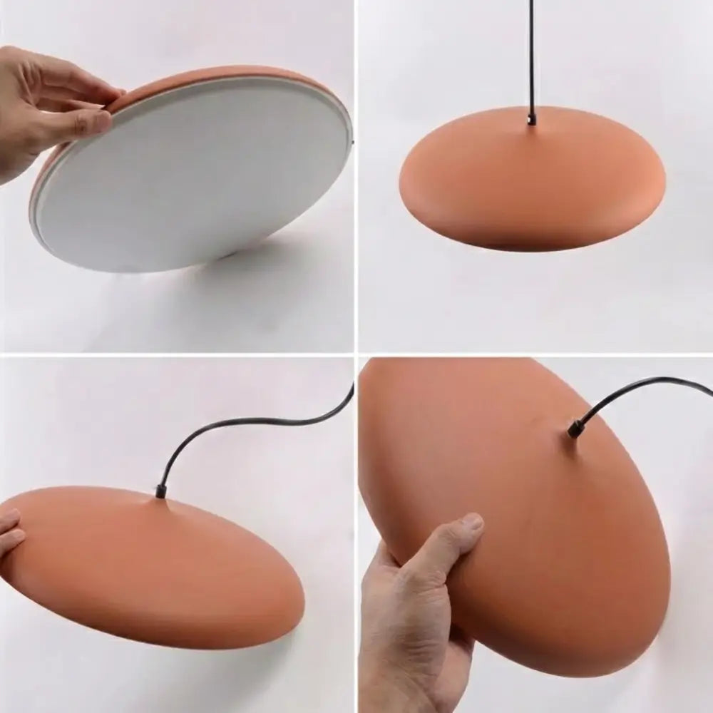 Fotos reais mostrando os detalhes de construção do Pendente Macaron Terracota: acabamento fosco, difusor em acrílico leitoso e perfil fino sendo manuseado.